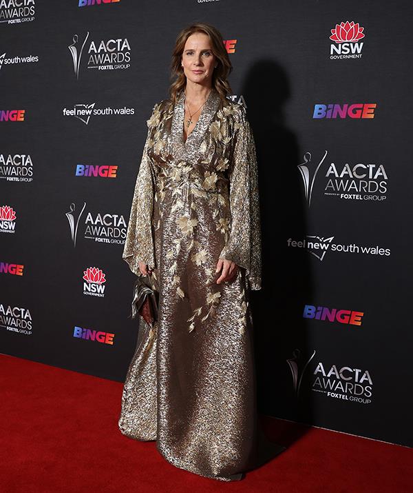 Australian acting royalty Rachel Griffiths looked elegant in this unique bronze gown. The *Muriel's Wedding* star styled her hair in soft, tousled waves.
