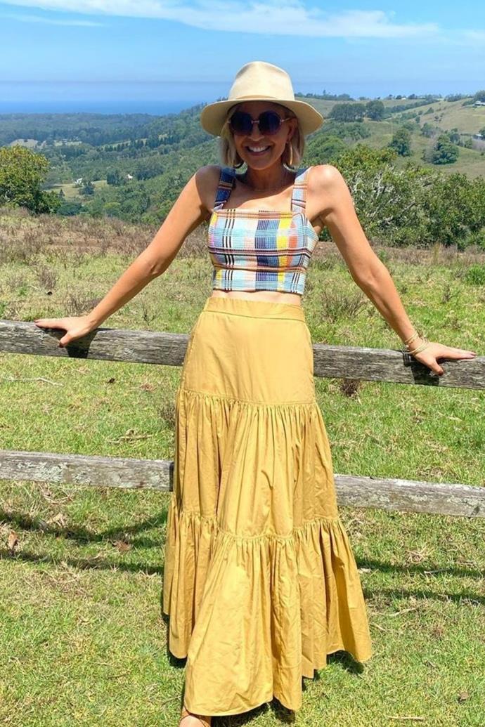 Carrie looked radiant under the sun in this mustard yellow skirt and [wide brim hat](https://www.nowtolove.com.au/fashion/fashion-trends/wide-brim-hats-australia-66445|target="_blank") for a trip to the countryside.