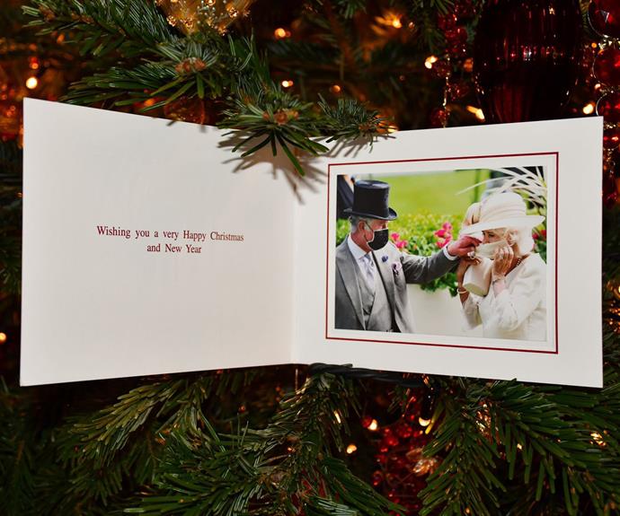 Prince Charles and Camilla, Duchess of Cornwall's 2021 Christmas card featured a candid photo from Royal Ascot, which showed the future king helping his wife adjust her face mask.