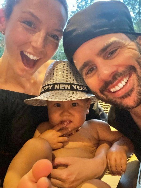 Ricki-Lee and her husband pose with Ricki-Lee's bestie's baby Yumi.