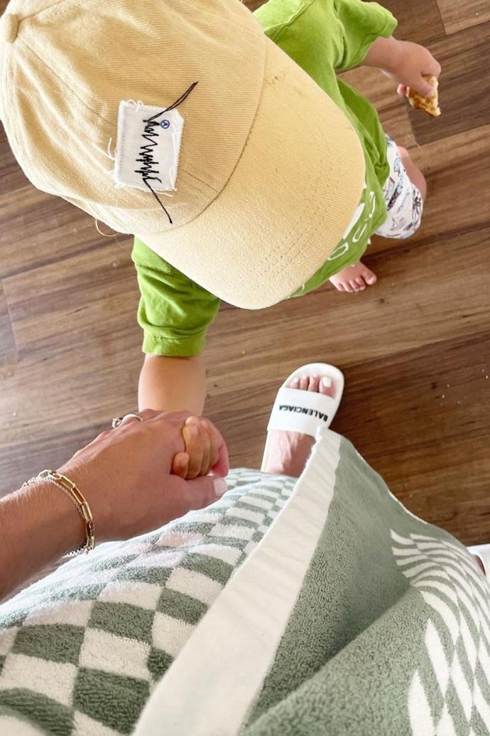 "When he holds my hand and doesn't bolt for more than a hot second I'm as happy as the happiest clam at high water. 🏊🏼 🏖 🥐," Sylvia gleefully captioned this snap with eldest son Oscar.