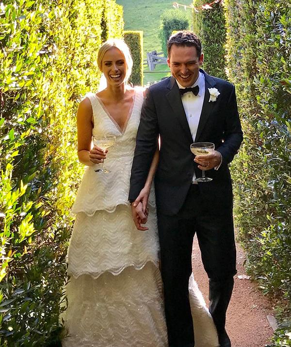 **Sylvia Jeffreys and Peter Stefanovic**
<br><br>
Surrounded by their nearest and dearest, the journalist couple tied the knot in 2017 in an outdoor ceremony by a lake on a private property in Kangaroo Valley.
<br><br>
Sylvia looked breathtaking in a tiered bridal gown by Aussie designer Rebecca Vallance that featured intricate beading and an understated train.
<br><br>
At the reception, guests were treated to an incredible evening of food and entertainment. Catering was provided by Aria, while the Baker Boys Band and DJ Elliott Hammond from The Delta Riggs looked after the music.
<br><br>
Guests included Sylvia's *Today Show* colleagues Lisa Wilkinson, Richard Wilkins, Richard's son Christian and former *Neighbours* star turned singer, Holly Candy, while Peter's brother Karl read a hilarious speech.