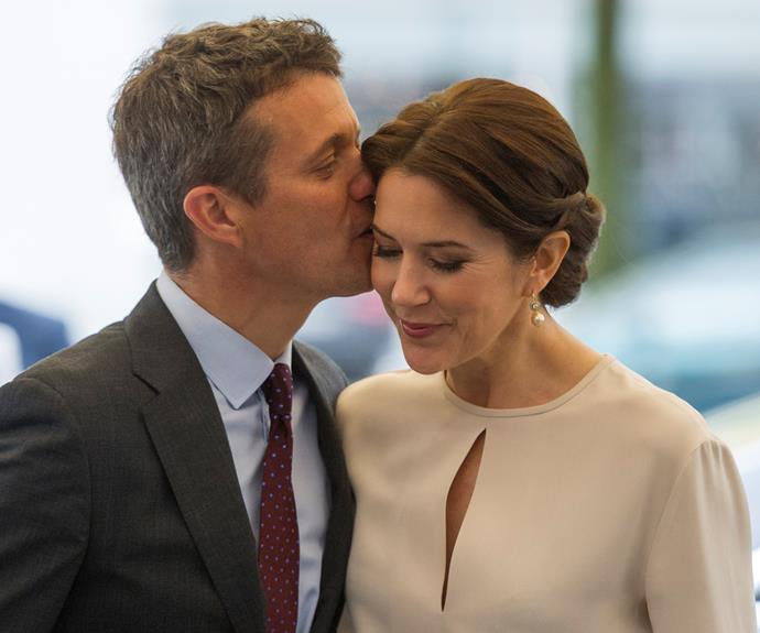 Crown Prince Frederik of Denmark shares a tender moment with his wife, Crown Princess Mary.