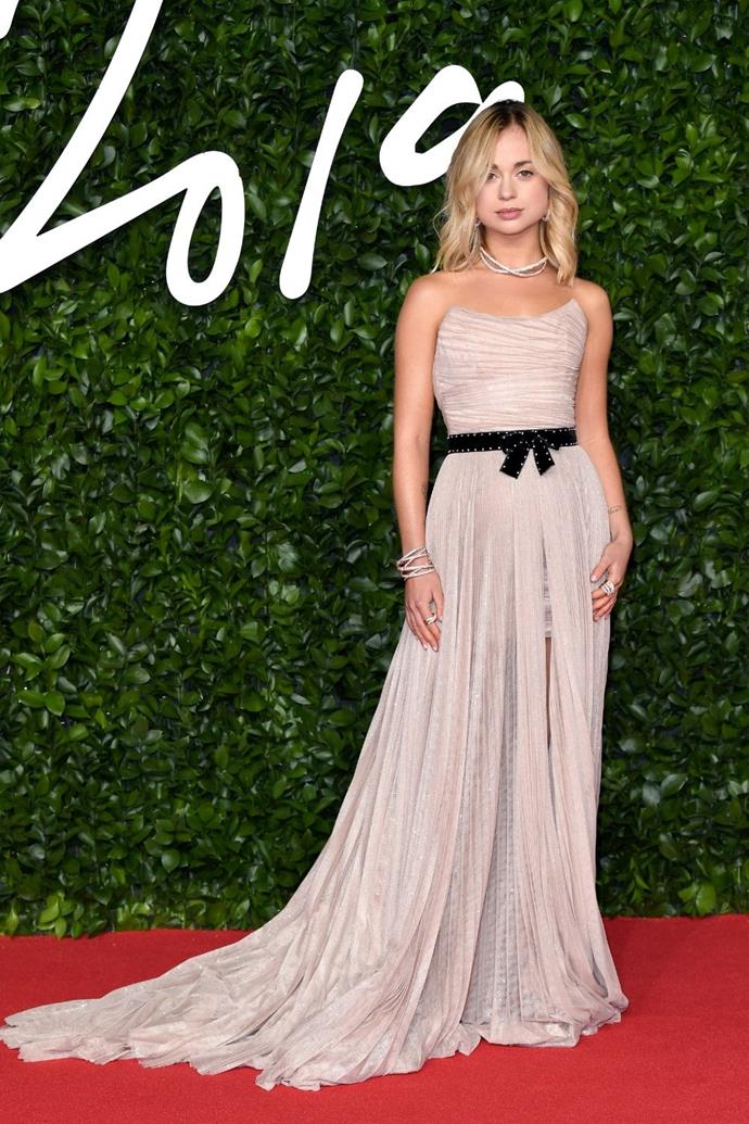 She wore this strapless dusty pink dress with a bow to 2019's Fashion Awards.