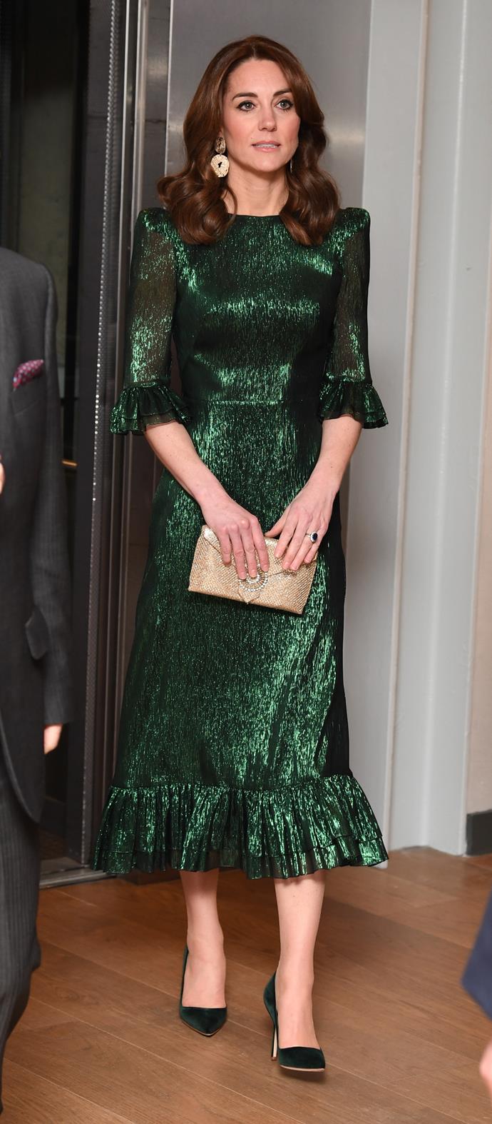 Her matching emerald green pumps were a delightful styling choice.