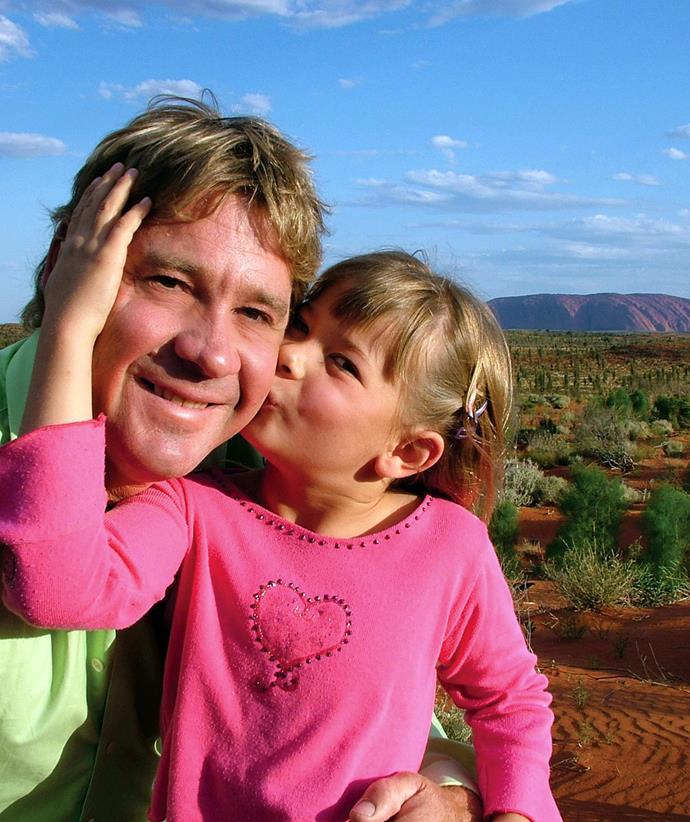 Steve Irwin cuddles up to his young daughter Bindi.