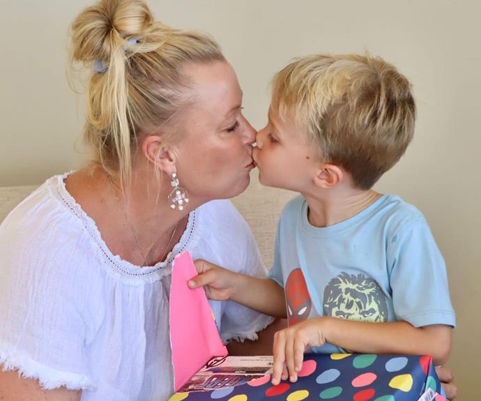 Lisa plants a kiss on the adorable birthday boy.