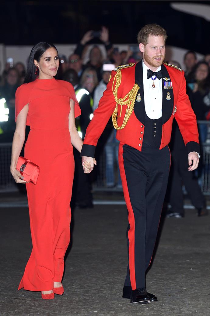 Meghan donned a mesmerising red Safiyaa gown featuring a floor-length cape to attend the Mountbatten Festival of Music with Harry in March 2020.