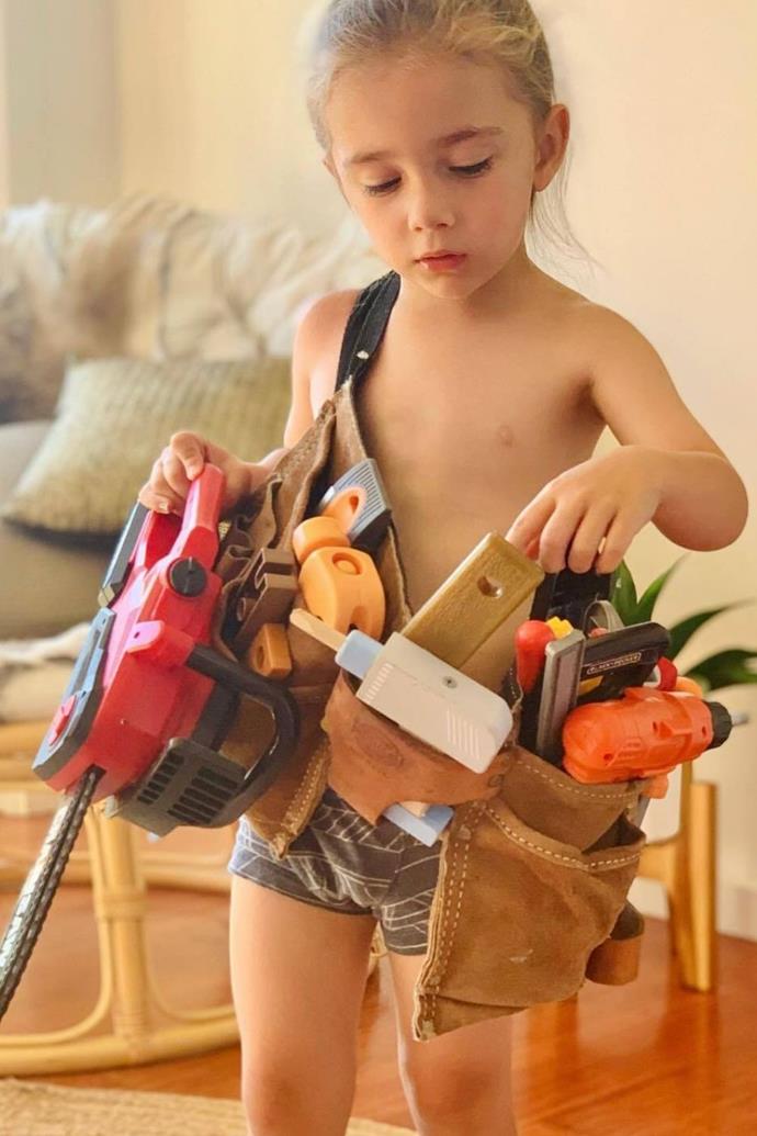 "My very handsome little builder in the making telling me what each & every tool in his belt is & does. 💛," gushed Tania.