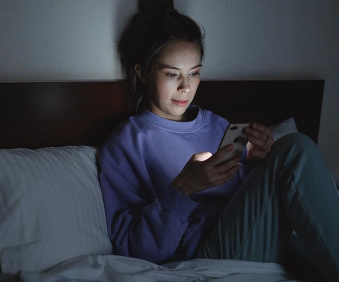 Sleep expert Olivia Arezollo recommends putting down your phone before bed or wearing 100 per cent blue light glasses.