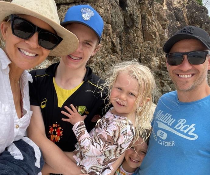 Carrie with her family during a trip to the beach.