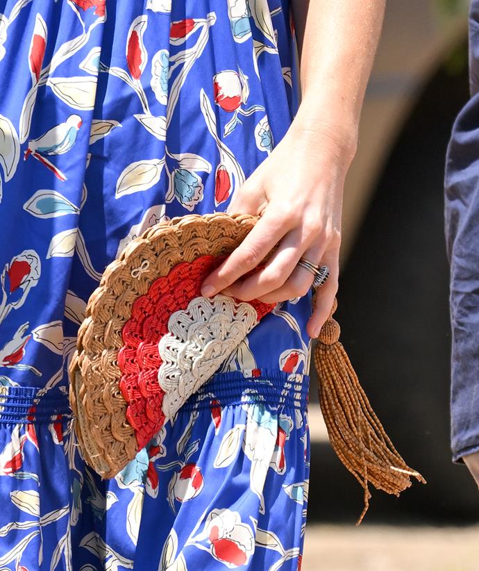 Catherine accessorised with this Anya Hindmarch Woven Fan Clutch, which she has had in her closet for years - the duchess was previously spotted carrying it in 2011 and 2014.