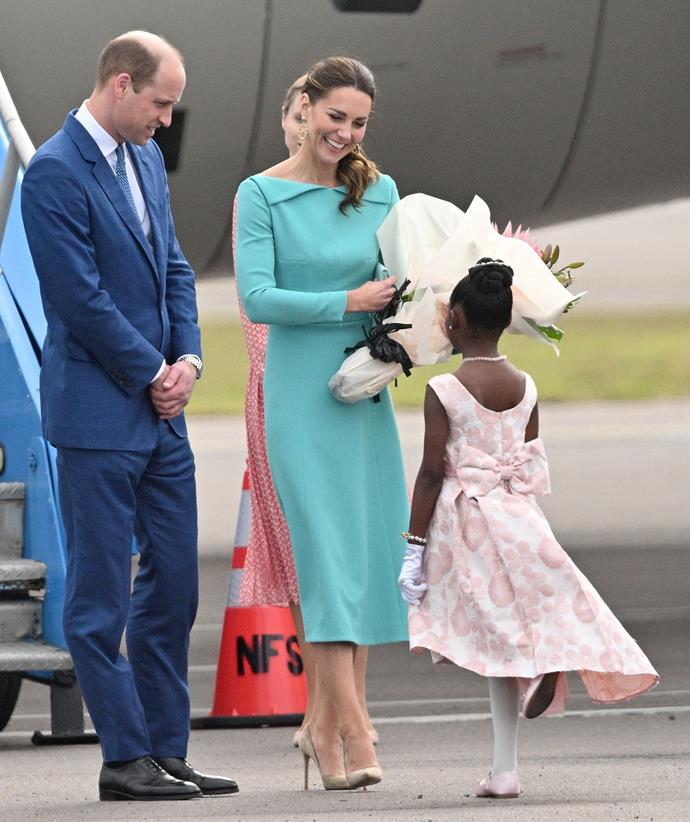 Too sweet! As they touched down in the Bahamas, Catherine changed into this bespoke Emilia Wickstead dress with a unique open collar.