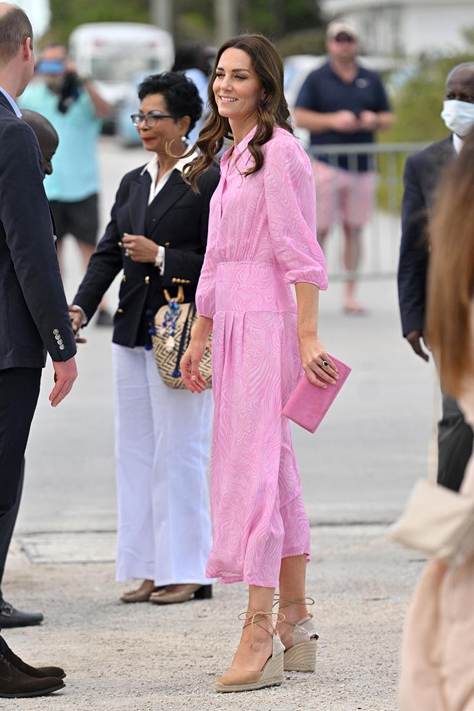 For the final day of her and William's tour of the Caribbean, Catherine slipped into this cotton candy pink Rixo dress with a matching clutch from Emmy London, one of her favourite brands and her trusty Castañer brown espadrilles.