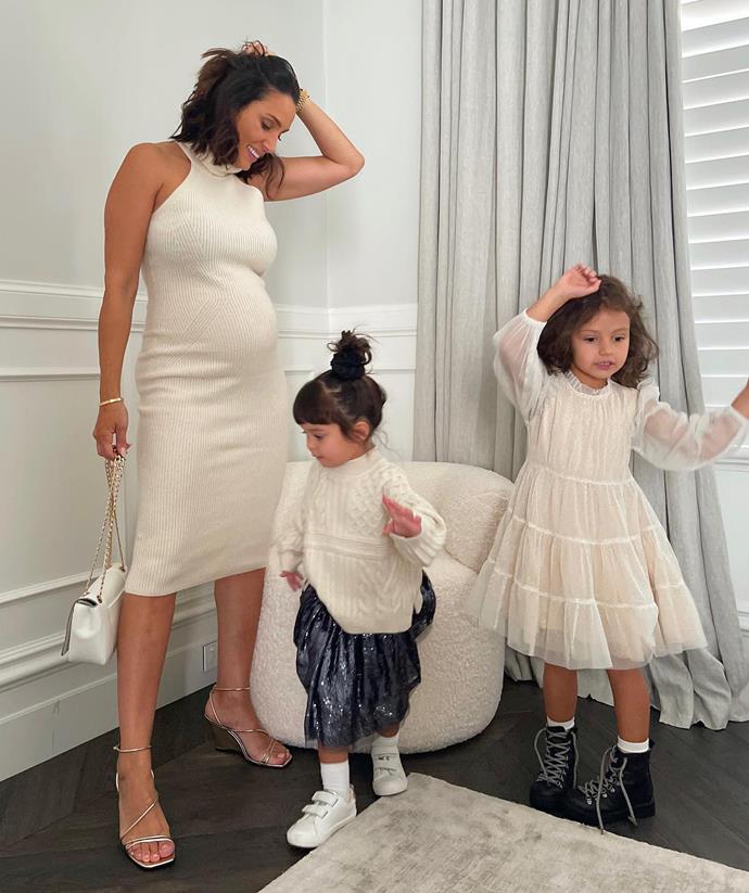 Snez was rocking her growing belly in a beautiful knitted dress while her youngest daughters twinned in matching cream ensembles.