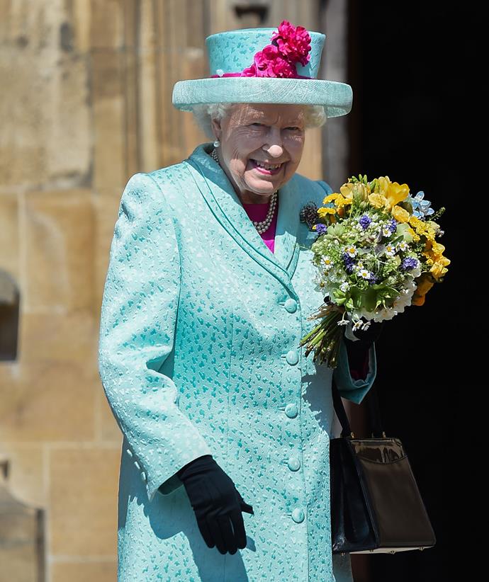 In 2019 the monarch chose a vibrant blue textured coat and hat with colourful pops of pink, including a swipe of pink lipstick.