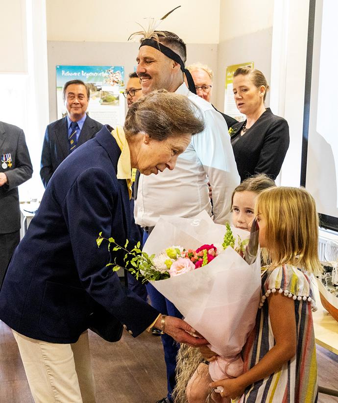 Her Royal Highness accepts flowers during a visit to the Sea Heritage Foundation in Waverton in Sydney, Australia.