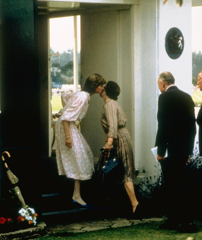 There were other candid moments with the monarch caught on camera in the 1980s, including this greeting kiss she received from Lady Diana Spencer in 1981.