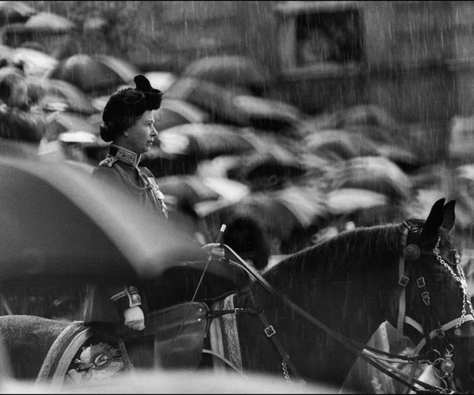 But it's not all fun and games when you're a monarch; here the ever dutiful Queen sits ahorse in the rain during in 1977.