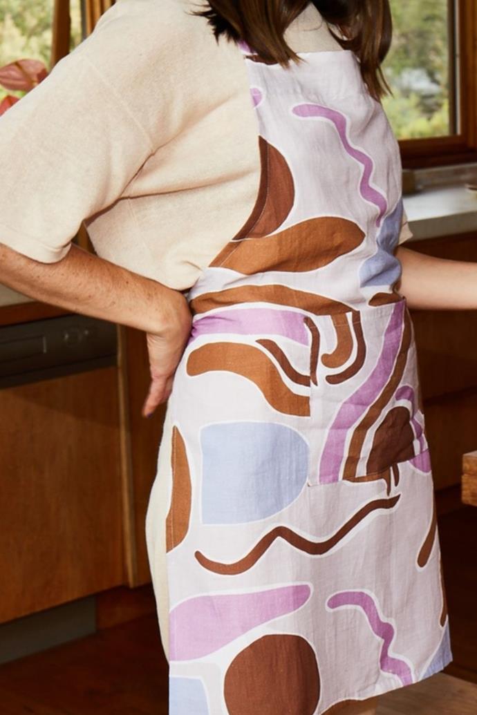 If your mum has used the same apron since your childhood, update her look with this Aussie made creation. 
<br><br>
**Mosey Me Half Mood Apron, $80.00, [The Iconic.](https://www.theiconic.com.au/half-moon-apron-1445866.html|target="_blank"|rel="nofollow")**