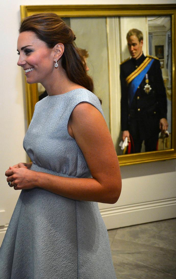 Even a painting of William can't keep his eyes off his wife!