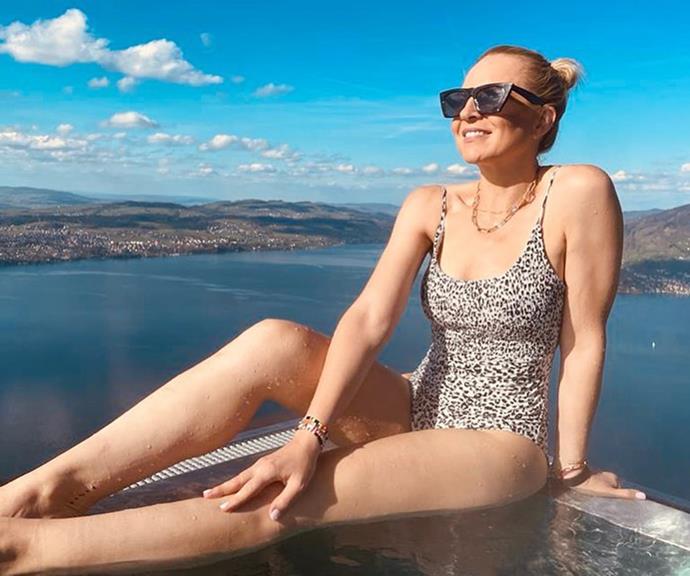 Carrie uploaded a modelesque shot of herself sitting on the edge of an infinity pool.