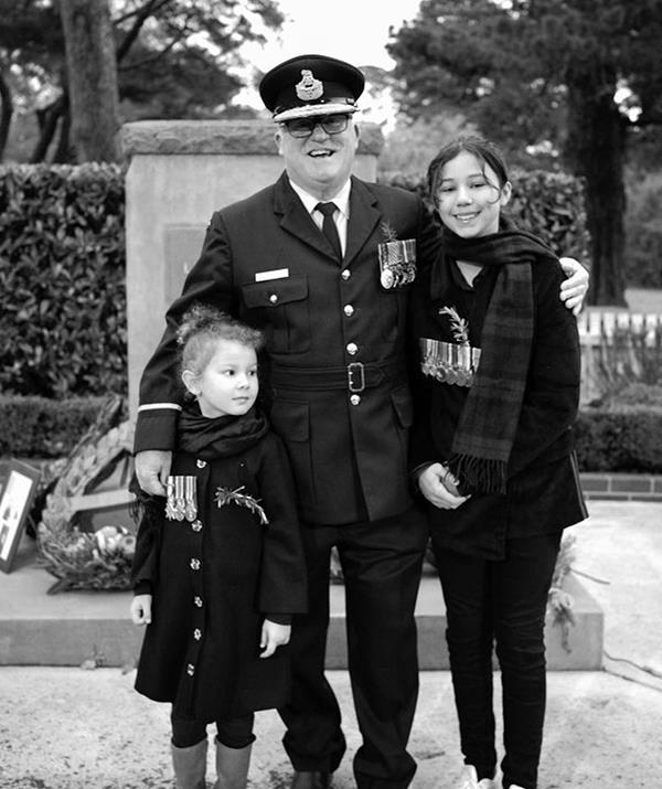 **Jimmy Barnes**
<br><br>
Aussie rock legend Jimmy Barnes shared this special photo of his granddaughters Ruby and Rosie at the dawn service with their pop, Air Commodore Robert Rodgers AM CSM.
<br><br>
"There are 3 generations of medals in these pics. Bob proudly says that his most important job is Pop. Thank you Anzac families for your Duty and Service," Jimmy penned.