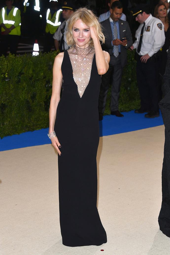**HIT:** Naomi Watts in Stella McCartney, 2017.
<br><br>
The black column dress alone may have been a miss, but the glittering mesh through the neck makes this dress a huge hit.