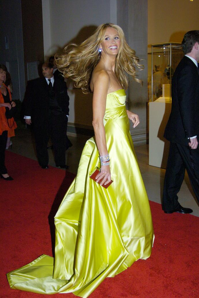 **MISS:** Elle Macpherson in Calvin Klein, 2005.
<br><br>
This dress was branded a miss by the media, but Elle adored it. She once told *People*: "My favorite red carpet moment is the acid-green, strapless luminescent dress with flip flops that I wore to a Met Gala."