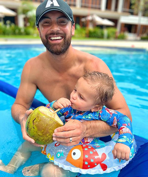 "Ollie settling into Island life just fine," Cam captioned this sweet snap from his and Jules' Fiji getaway in April 2022.