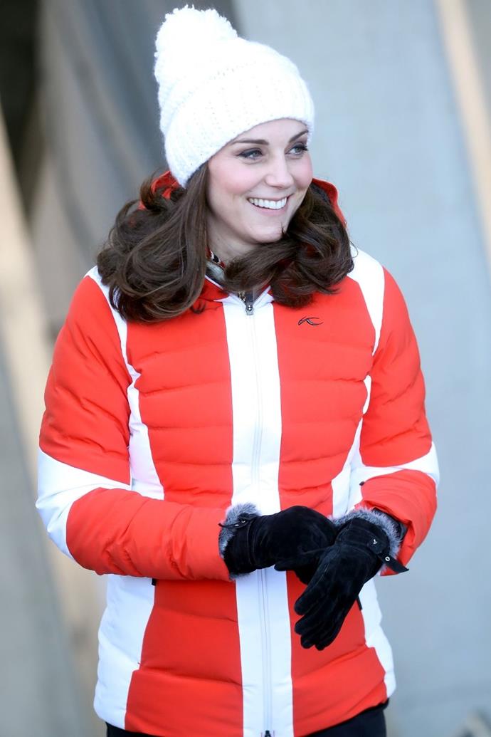 During her pregnancy with Prince Louis, Catherine wore another red puffer jacket to keep out the winter chill.
