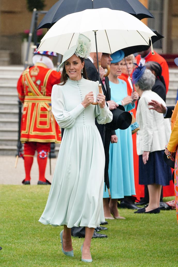 For her second 2022 garden party, Catherine donned a mint green frock fans first saw her wear at the 50th anniversary of Prince Charles's investiture in 2019. Is this her boldest hat choice yet?