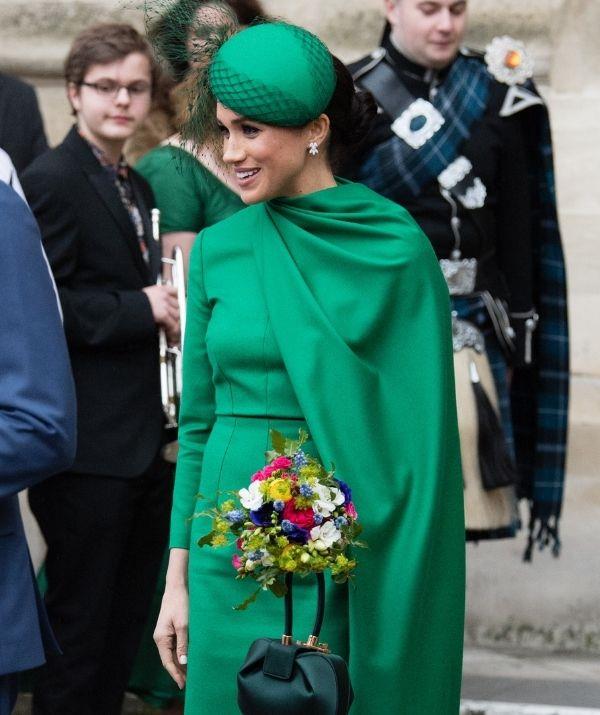 Of course, Catherine isn't the only duchess to sport green Emilia Wickstead. During the 2020 Commonwealth Day Service in March, the Duchess of Sussex looked radiant in an emerald-green cape midi dress with long regal sleeves.