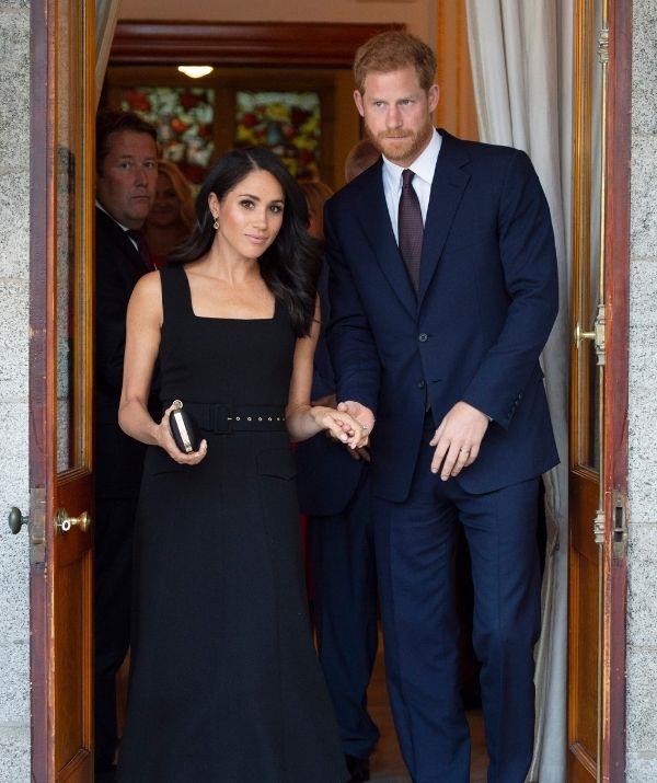 The Duchess of Sussex looked equal parts classy and regal in this mid-length, square-neck black Emilia Wickstead dress, worn to a 2018 reception at Glencairn in Ireland.