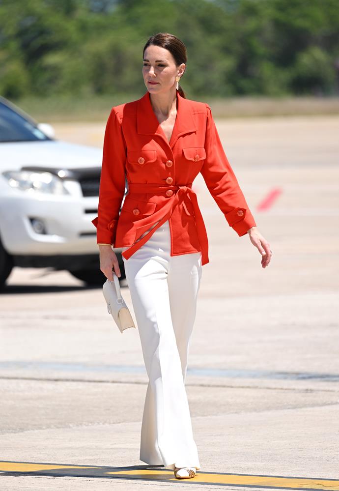 The recycling duchess paired her vintage red Yves Saint Laurent blazer with these dazzling white wide-leg trousers and a Mulberry mini bag while on a [royal tour of the Caribbean](https://www.nowtolove.com.au/royals/british-royal-family/kate-middleton-prince-william-cacao-farm-caribbean-tour-71490|target="_blank").