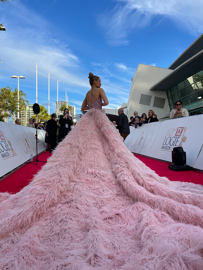 April Rose Pengilly made quite a tickled pink entrance.
<br><br>
She spoke to *TV WEEK* about returning to the Logies. She said, "The last time I was here it was 2007. It's great to be back with some of my really old friends and new friends and to be part of this legacy that is *Neighbours.* I'm really proud of it.

