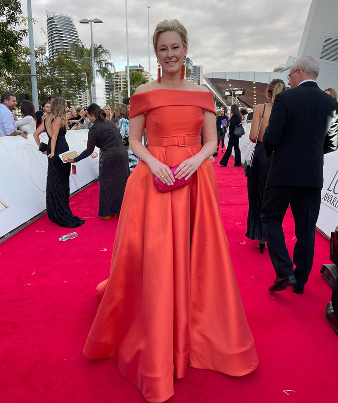 ABC veteran journalist Leigh Sales opted for an orange gown featuring a belted waist and off the shoulder detailing.