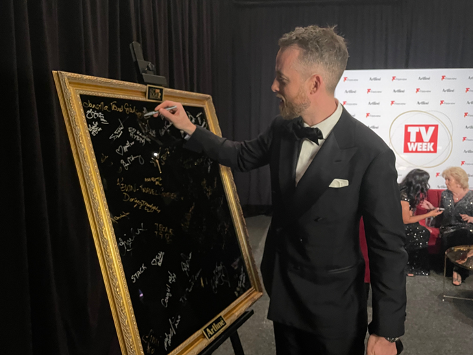 But not before signing his name backstage at the awards!
