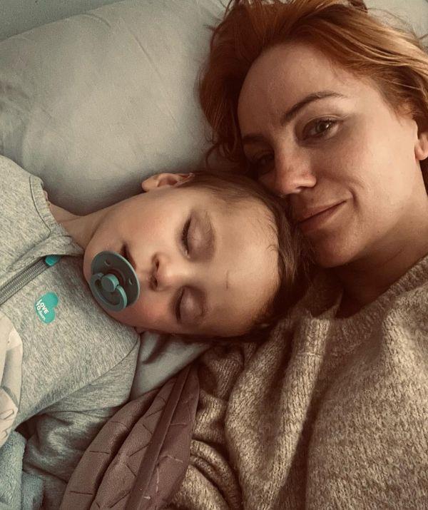 Alongside this sweet snap, she shared this relatable musing, "Wide awake from 3 am to finally drift back to sleep around 6 am with this little one. I swear he grew in 3 hours."