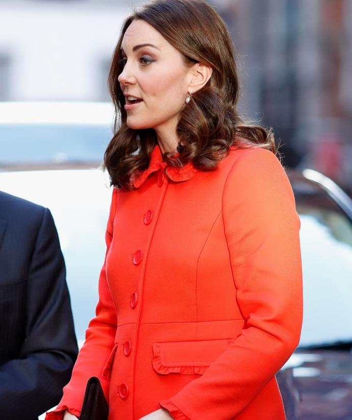 While pregnant with Prince Louis, Kate lit up Great Ormond Street Hospital in this vibrant orange coat.