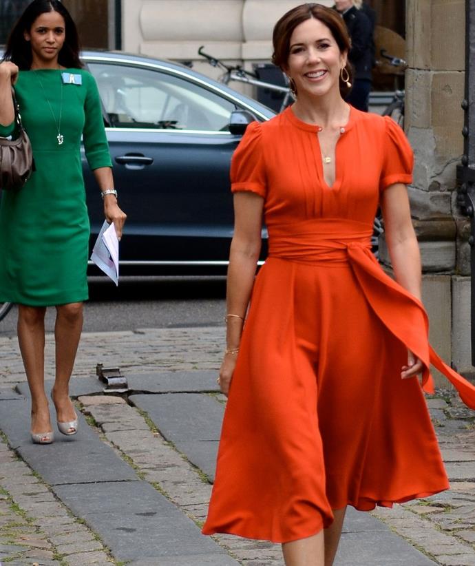 Princess Mary wore this casual orange dress to attend the St. Petersburg Loye Prize ceremony - and the hue wonderfully complimented her hair colour.