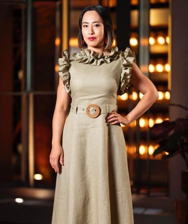 With a ruffled trim and built-in belt, this sleeveless, metallic beige, Torannce dress complemented the judge exquisitely.