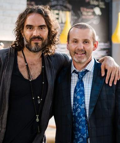 **Russell Brand**
<br><br>
The British comedian was on tour in Australia in the Spring of 2020 when he took part in a quick Ramsay Street cameo. In his appearance, Russell attended the Erinsborough Writers Festival and struck up an animated conversation with Toadie.