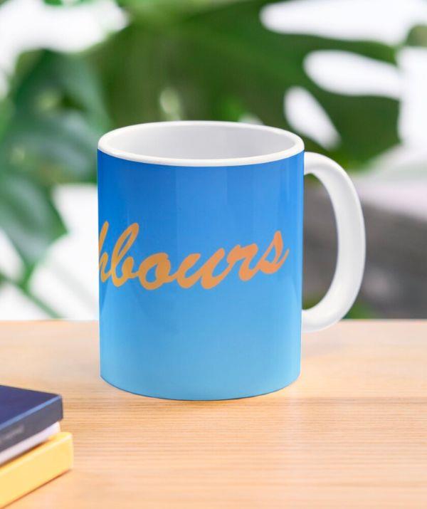 **[*Neighbours* retro coffee mug, Redbubble, $28.11](https://www.redbubble.com/i/mug/Neighbours-everybody-needs-good-ones-Retro-by-drunkenvictim/68672209.9Q0AD?country_code=AU|target="_blank")**
<br><br>
Everybody needs good neighbours - and good coffee! Sip on your favourite blend with this retro *Neighbours* mug.
<br><br>
