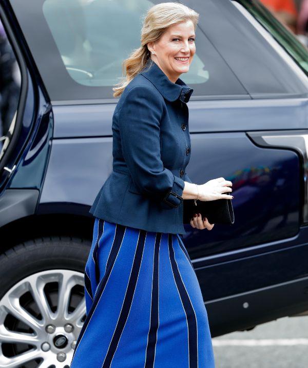 We are obsessed with this skirt. Sophie rocked the blue and black number in March 2022 while meeting her 90-year-old pandemic phone friend Edna Farley at the Sir Ken Dodd Happiness Hall.