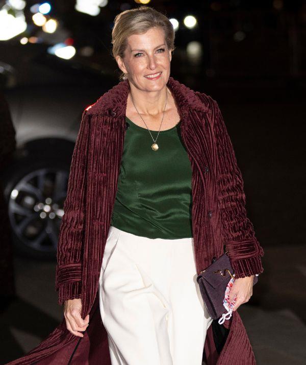 The Countess of Wessex was in theme for the *Together at Christmas* community carol service at the end of 2021 with this green, red and white outfit. Fans were particularly taken with her Victoria Beckham cotton-velvet trench coat, which really completed the look.