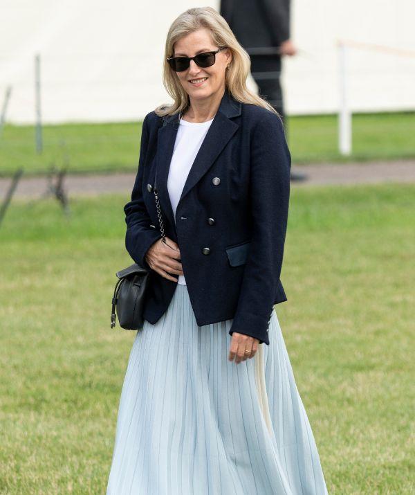 During the 2021 Royal Winsdor Horse Show, Sophie kept it classy-yet-casual with this pale blue pleated skirt by ME+EM, coupled with a striking navy blazer from Gamebirds.