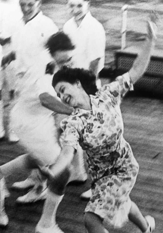 This joyful image of the Queen running free-spirited on the deck of a ship was taken in 1947 - she was playing tag with the midshipmen on board the HMS Vanguardin.