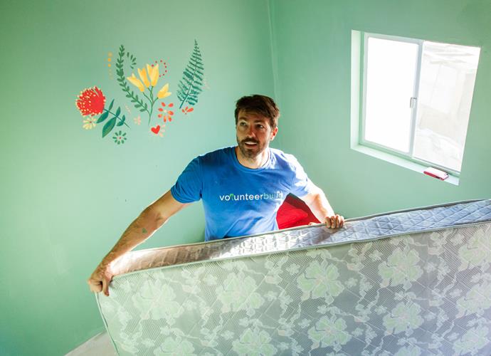 Art puts the finishing touches on the newly built home. *Photo: Emily Hlavac Green*