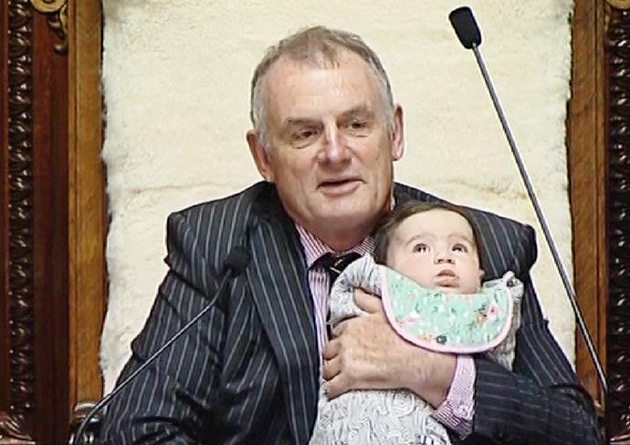 Trevor holds baby Heeni during a House debate.